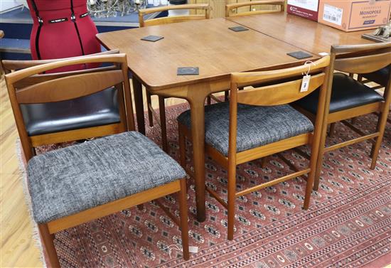 A Mackintosh extending dining table and 8 chairs, 236cm fully extended